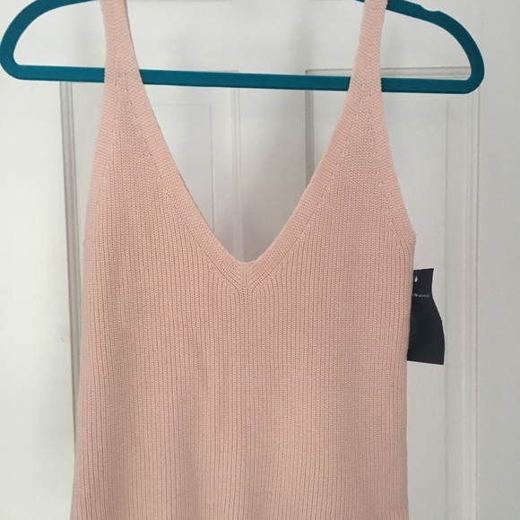 Brandy Melville Tops - NWT Brandy Melville top & FREE sticker